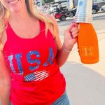 Denise Lite Supporter at 8am holding a bottle of liquor in an area where liquor is prohibited. 📷 by Denise Lite